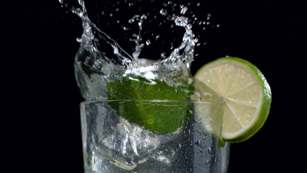 istock Mojito drink with splash, closeup 1296492358