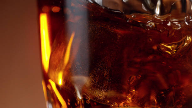 istock Closeup of cola drink with ice cubes inside. 1296492419