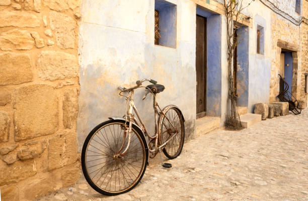 istock Vintage bicycle leaning on a street wall from Valderrobres 1296494444
