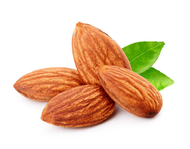 Almonds with leaves isolated on white background Almonds with leaves isolated on white background almond tree stock pictures, royalty-free photos & images