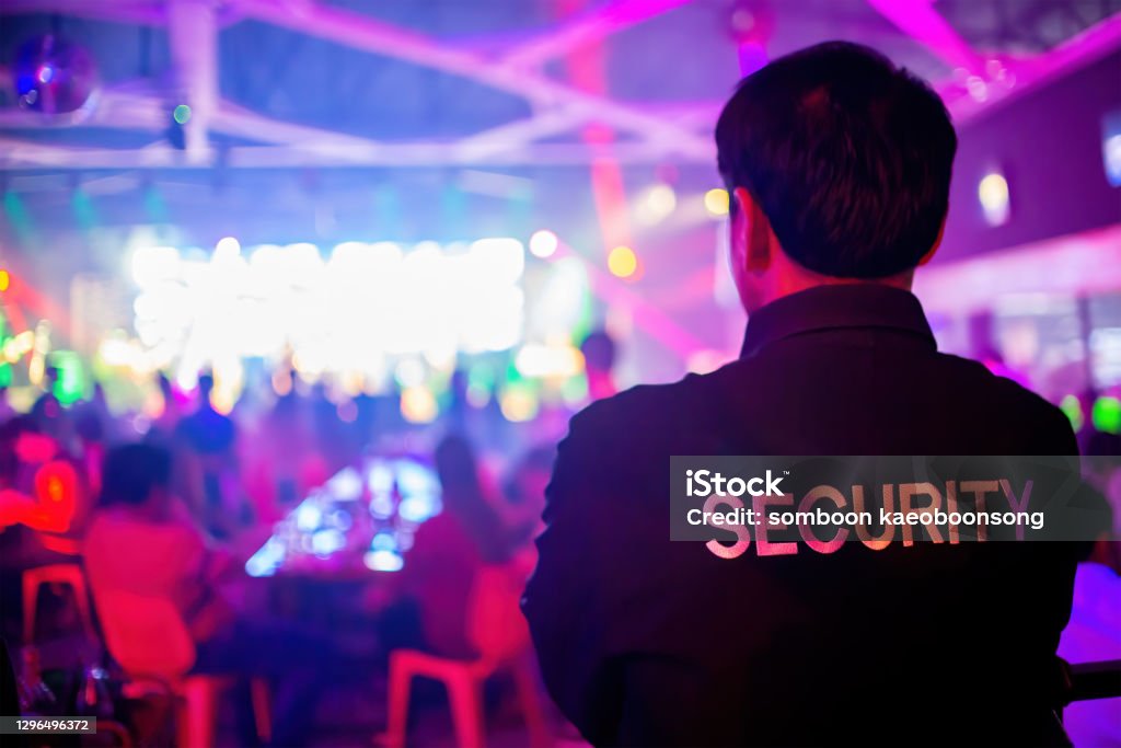 Security guard  are regulating the situation of safety in an event concert in a nightclub. Security Staff Stock Photo