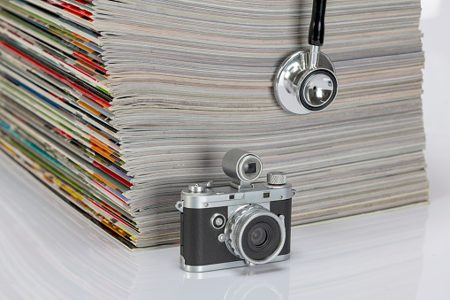 Stethoscope and camera next to skins.