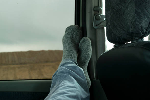 istock Feet in the car interior 1296500239