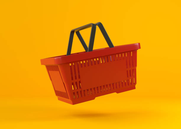 flying red empty shopping basket on yellow background - shopping basket imagens e fotografias de stock