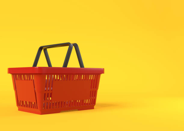 istock Red empty shopping basket on yellow background 1296500688