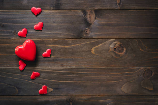 istock Red heart on wooden background, valentine background with copy space. 1296503509