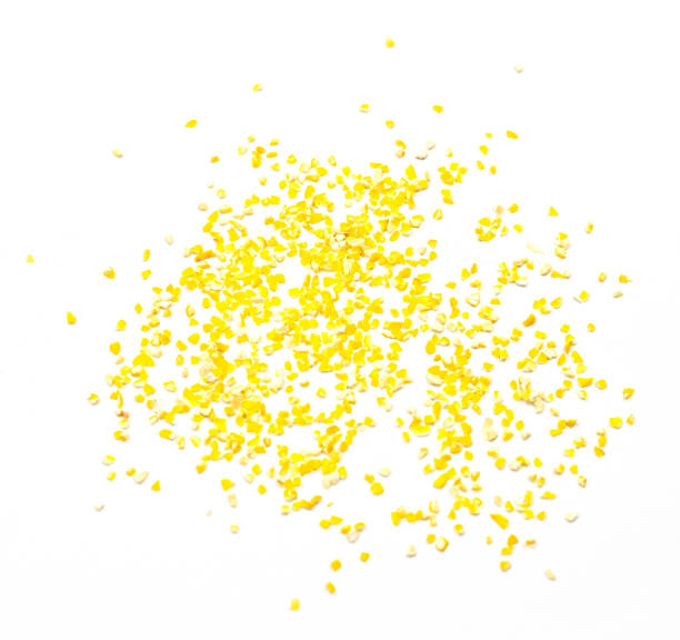 istock a pile of corn grits isolated on a white background, top view 1296503915