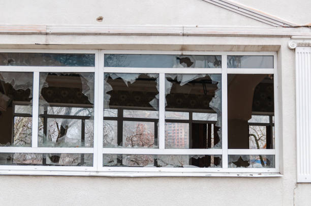 istock Acts of vandalism, broken windows in an abandoned building 1296504054
