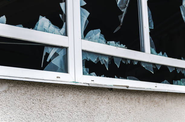 istock Acts of vandalism, broken windows in an abandoned building 1296504063