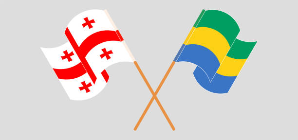 Crossed and waving flags of Georgia and Gabon Crossed and waving flags of Georgia and Gabon. Vector illustration georgia football stock illustrations