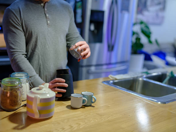 istock Man grinding coffee in electric grinder 1296507375