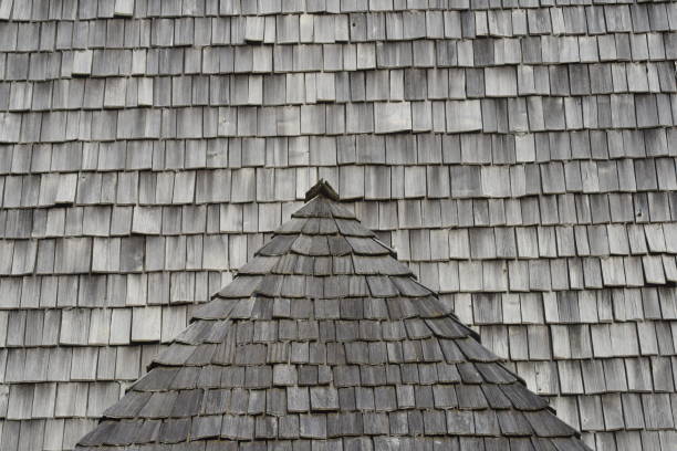 istock wooden shingle on a house roof 1296507889