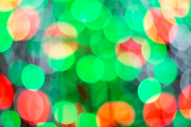 istock Bokeh lights decorated with multi colored Christmas trees 1296510335