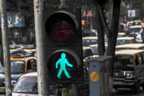 green pedestrian traffic light on the street, visual signal for road users