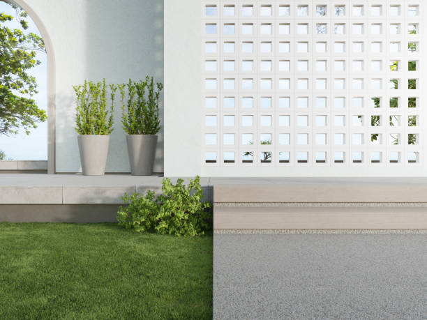 istock White ventilation block wall and empty concrete walkway. 1296511866