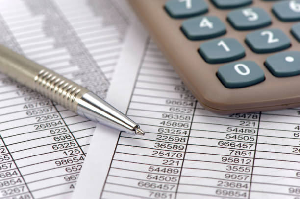 istock finance and economy with calculation and chart 1296511966