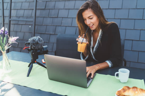 istock Influencer at home vlogging from the terrace 1296512051