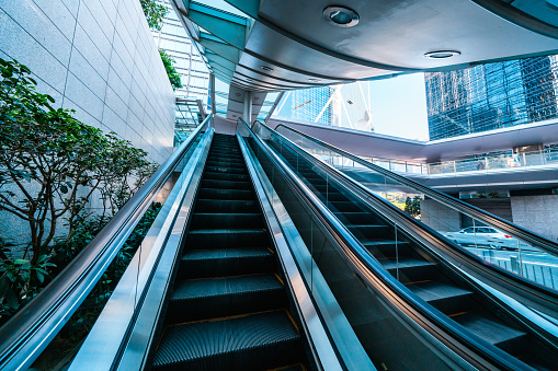 Escalator and modern office buildings in downtown