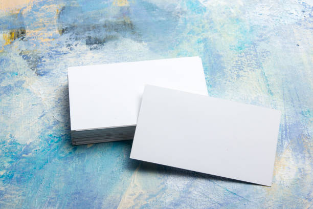 istock Business cards blank. Mockup on color background. Flat Lay. copy space for text 1296515539