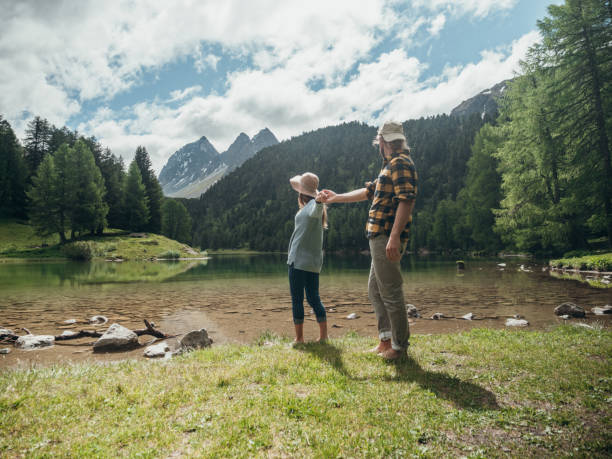 istock Couple relax by the lake in Summer 1296515779