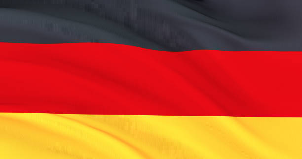 揮舞著德國織物旗，德國絲綢旗，獨立日 - 德國國旗 個照片及圖片檔