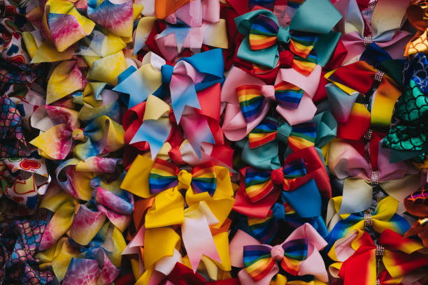 istock Quirky, colorful bowties hanging from a wall at a market. 1296517848