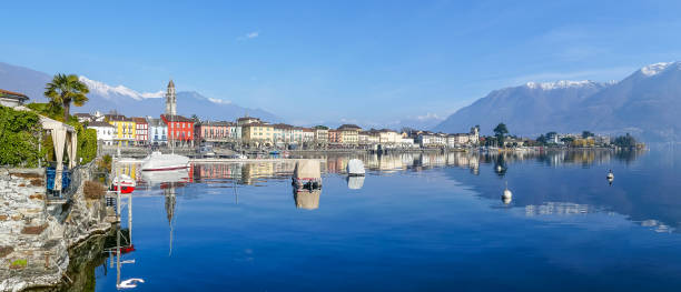 Panorama of Ascona with houses with colorful facades reflecting on Lake Maggiore stock photo