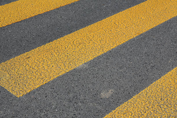 istock Pedestrian crossing marked with yellow zebra 1296523346