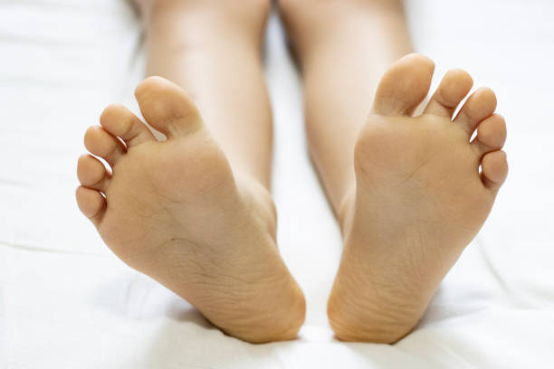 istock children's heels on a white bed close-up 1296524871
