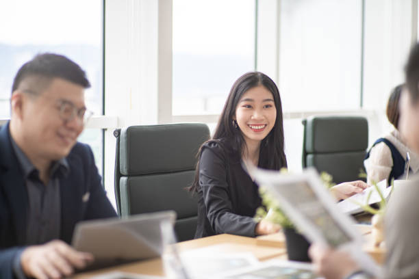 istock Asian group of Chinese white collar worker working in their workplace. 1296527281