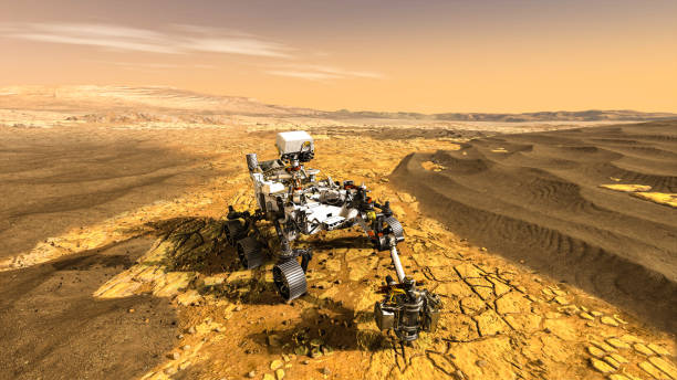 istock Unmanned rover vehicle on Mars exploration mission runs through planet ground . 1296532066