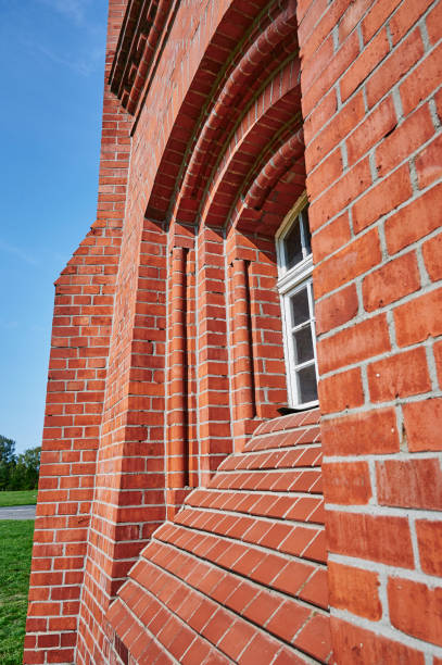 istock Details of a historic red brick water tower. 1296532225