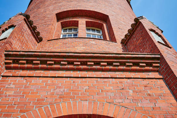 istock Details of a historic red brick water tower. 1296532817