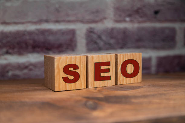 istock Seo word written on cube wooden blocks. 1296533647
