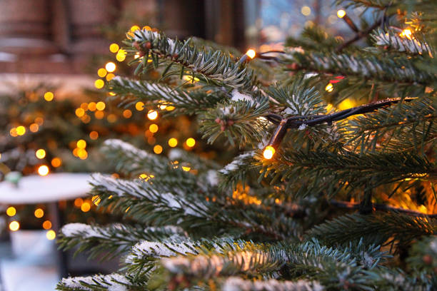 istock Decorated Christmas tree with lights on a blurry background 1296534001