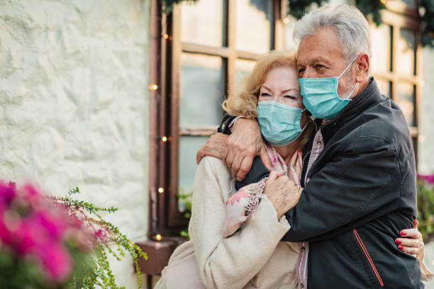 istock Senior couple wearing protective face masks 1296536769