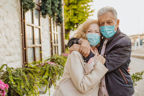 istock Senior couple wearing protective face masks 1296536804