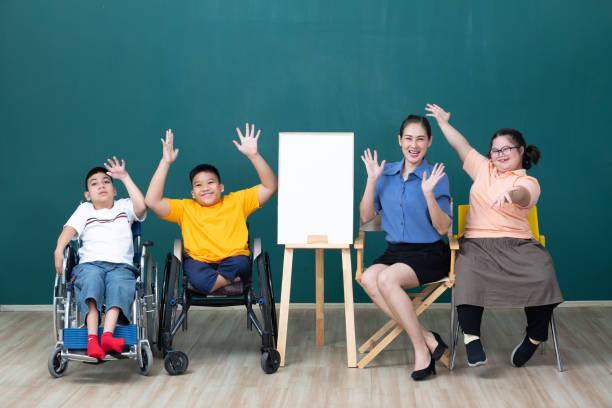 asian group of disabled kids or autism child and woman teacher cheering form success in art class asian group of disabled kids or autism child and woman teacher cheering form success in art class developmental disability stock pictures, royalty-free photos & images