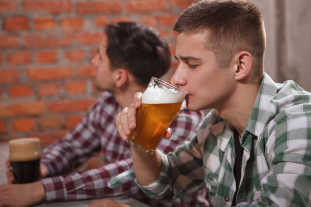 istock Friends drinking beer at the pub 1296541661
