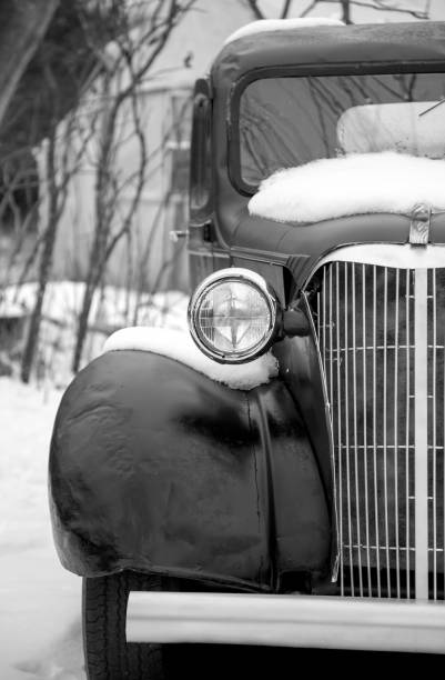 red old fiat 500 covered with thick layer of snow