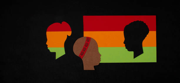 istock Black History Month. Human silhouettes on paper background. Copy space. 1296542189