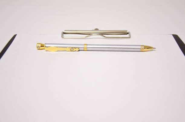 istock pen tablet lies on a white background. office supplies 1296543621