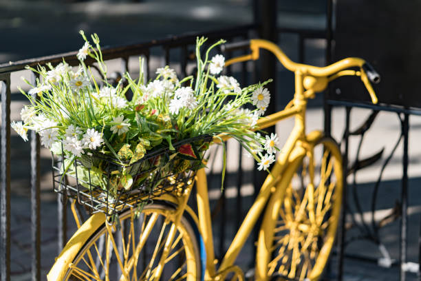 istock Vintage bicycle on city fence background 1296543977