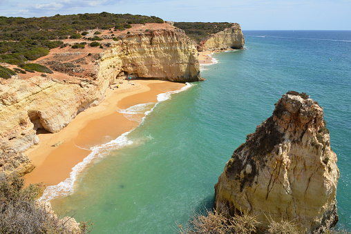 Ferragudo, Lagoa, Algarve / Faro District, Portugal: Praia do Torrado beach and its islet seen from the cliffs of Ponta do Altar.