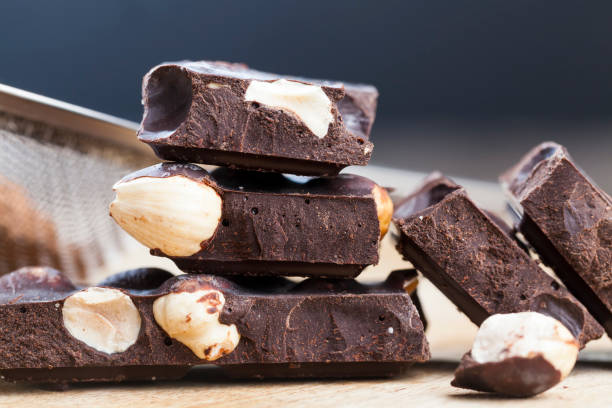istock pieces of chocolate with hazelnuts 1296550036