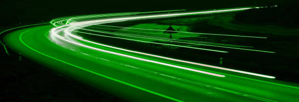 istock green car lights at night. long exposure 1296552949
