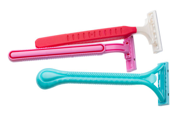 istock Disposable shaving razors isolated on white background 1296554751