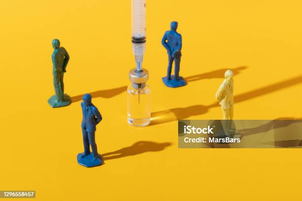 Antivaxxer Antivaccination Concept On Yellow Stock Photo - Download Image Now - Anti-vaccination, Vaccination, Suspicion