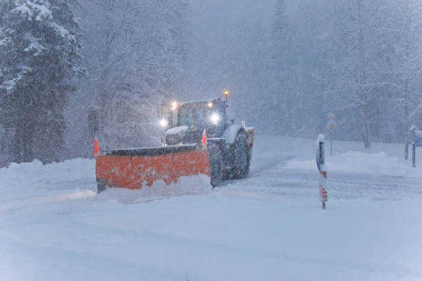istock Snow plow tries to clear an intersection during a heavy snow storm 1296560129