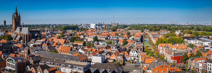 High angle view of Delft, South Holland, Netherlands. The Oude Kerk on the left and the Gracht (Canal) Vrouwjuttenland on the right.